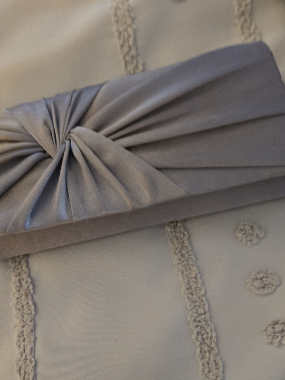 Charming Charlie Silver Satin Twist Knot Clutch
